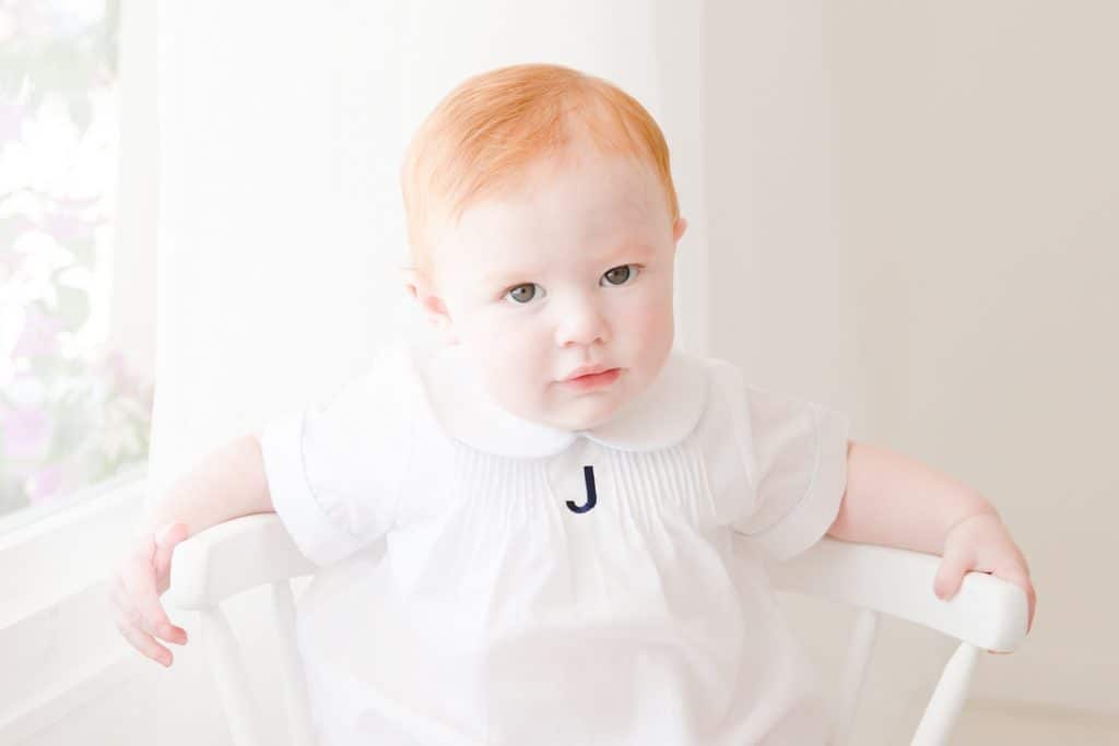 Baby boy at his 6 months photo shoot in jupiter florida photography studio