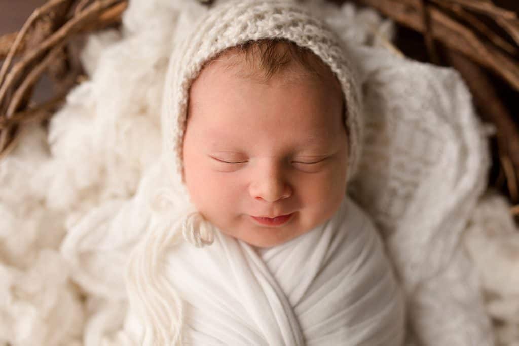 Newborn baby boy's first professional newborn photographers images in Jupiter Florida photography studio.