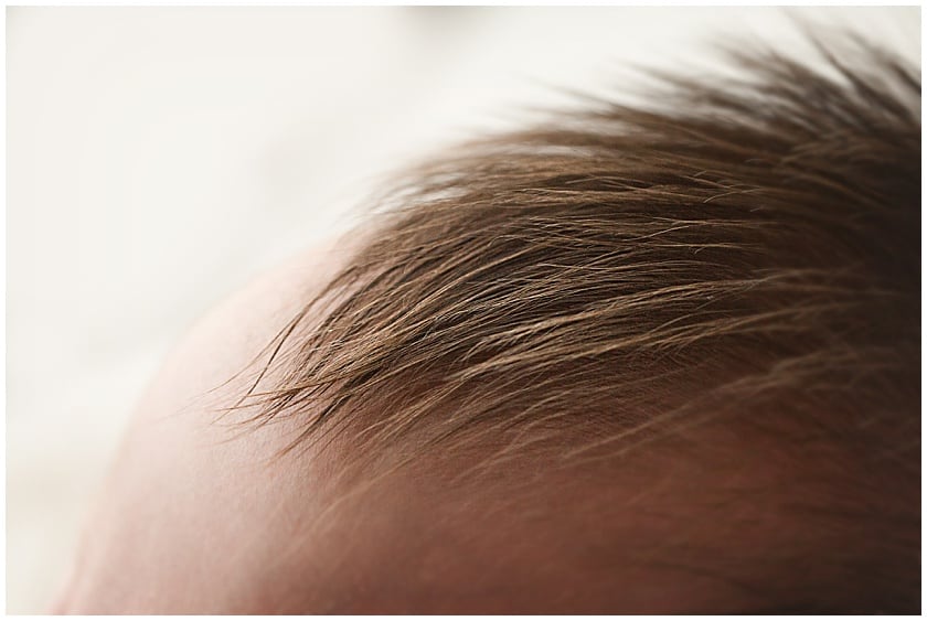 Close up of baby's fuzzy spikes brown hair