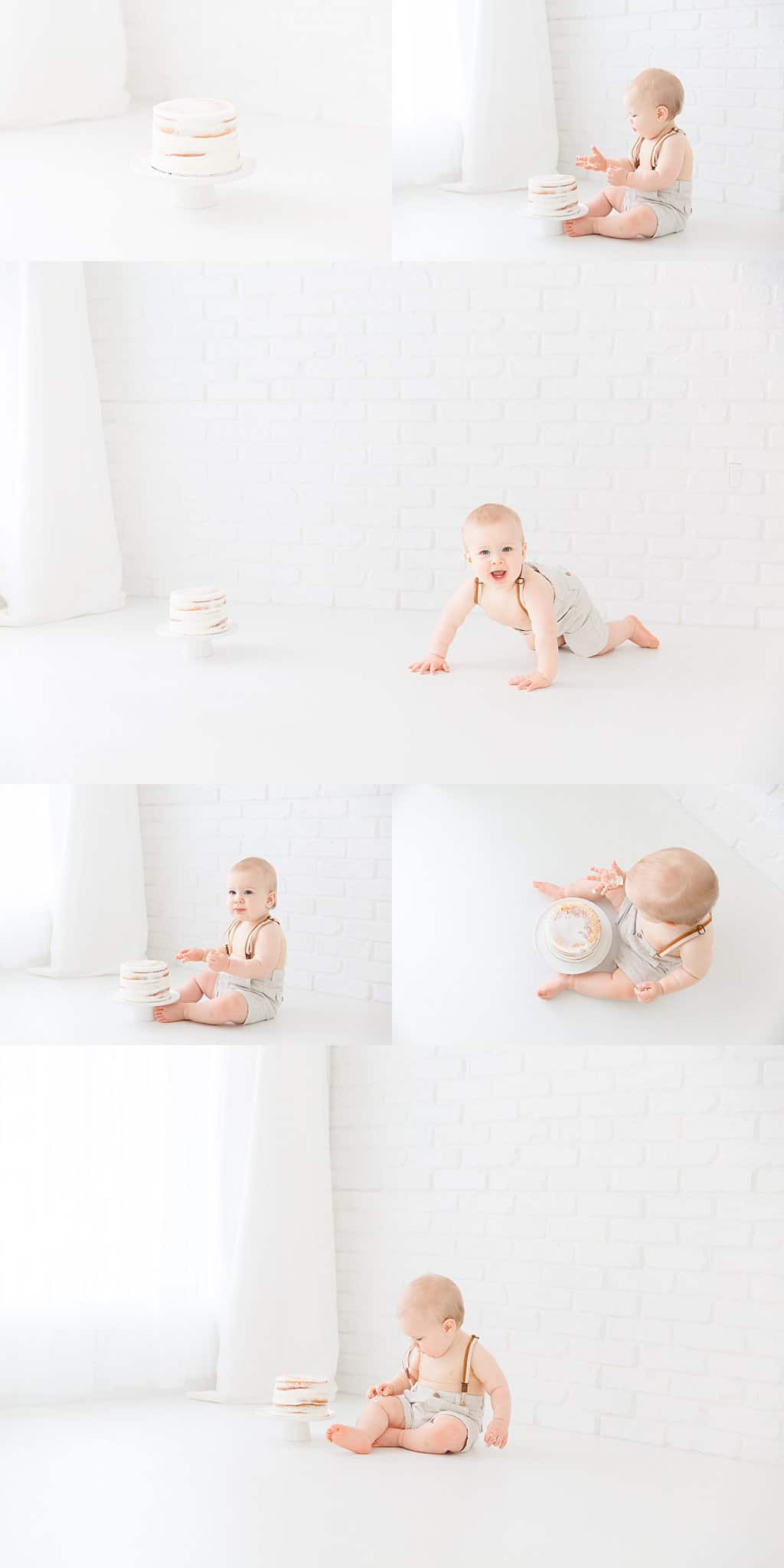 baby boy cake smash in front of white brick wall