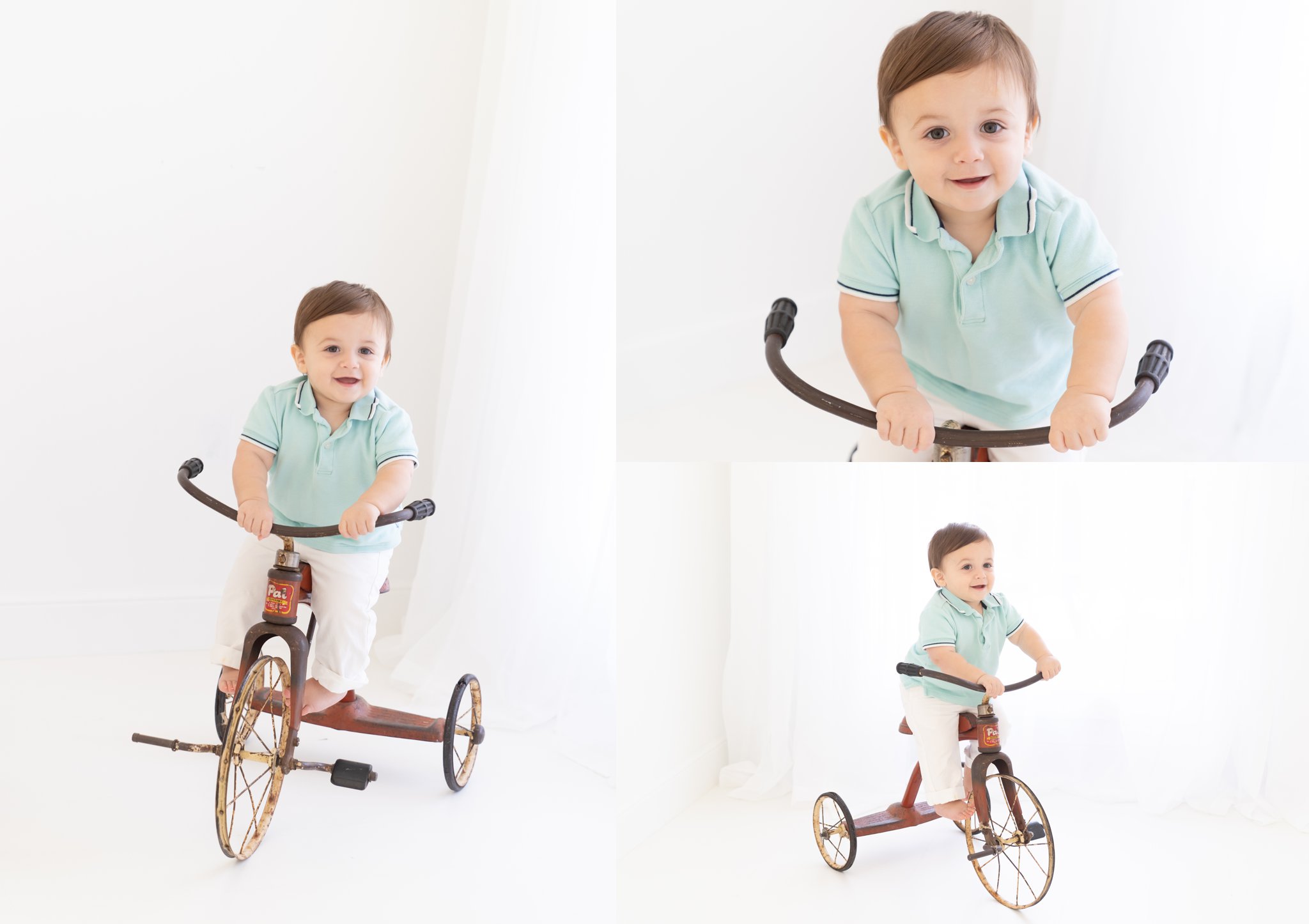 Baby boy being photographed on old tricycle .
