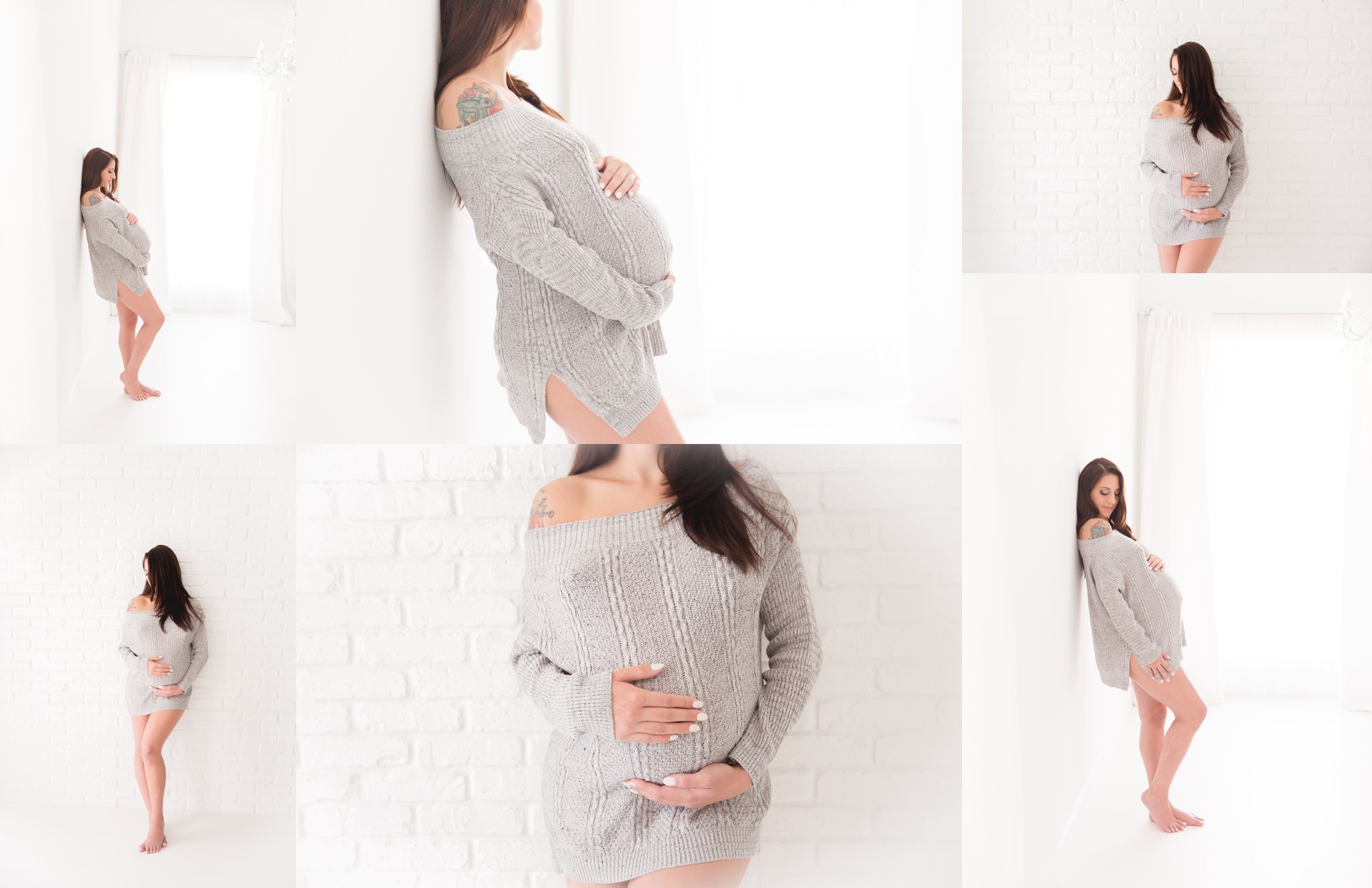 mother-to-be wearing grey sweater leaning on plain white studio wall