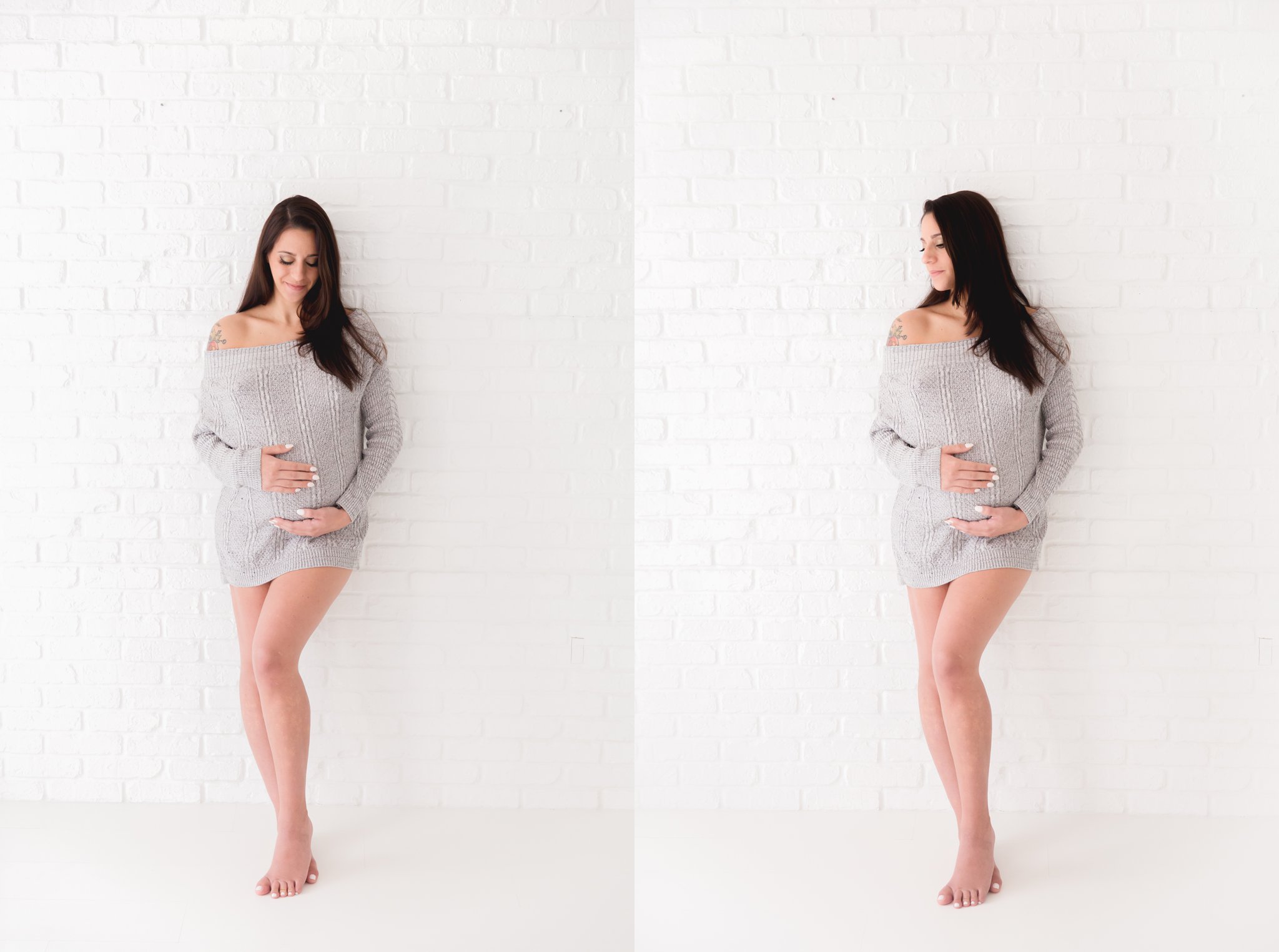 Maternity model wearing grey sweater leaning on brick wall backdrop.