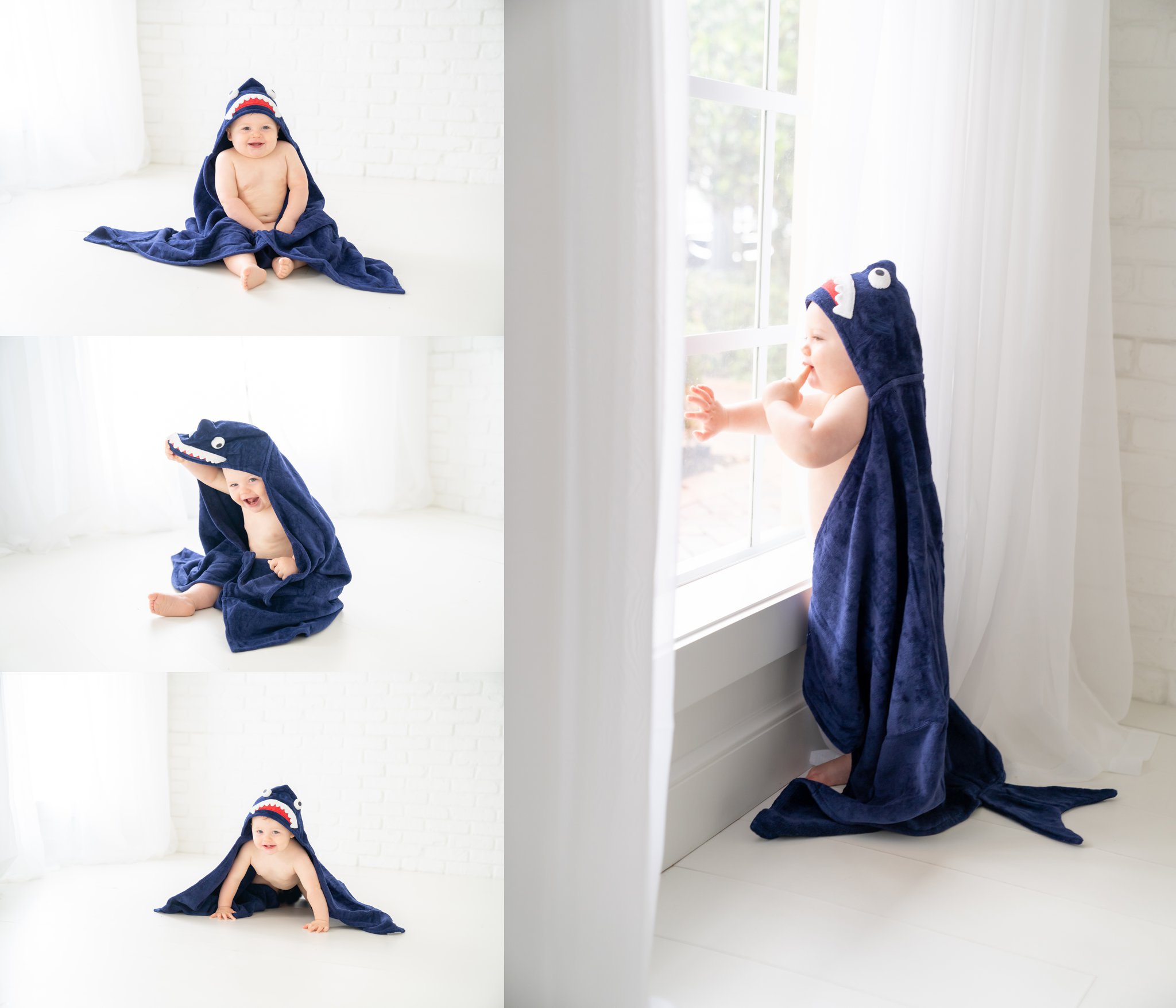 One year old baby in shark towel in south florida baby photography studio. 