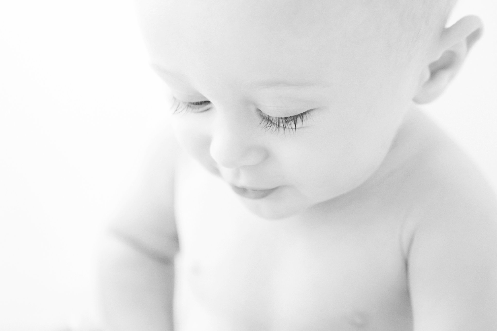 baby boy being photographed in a Jupiter FL all white photography studio