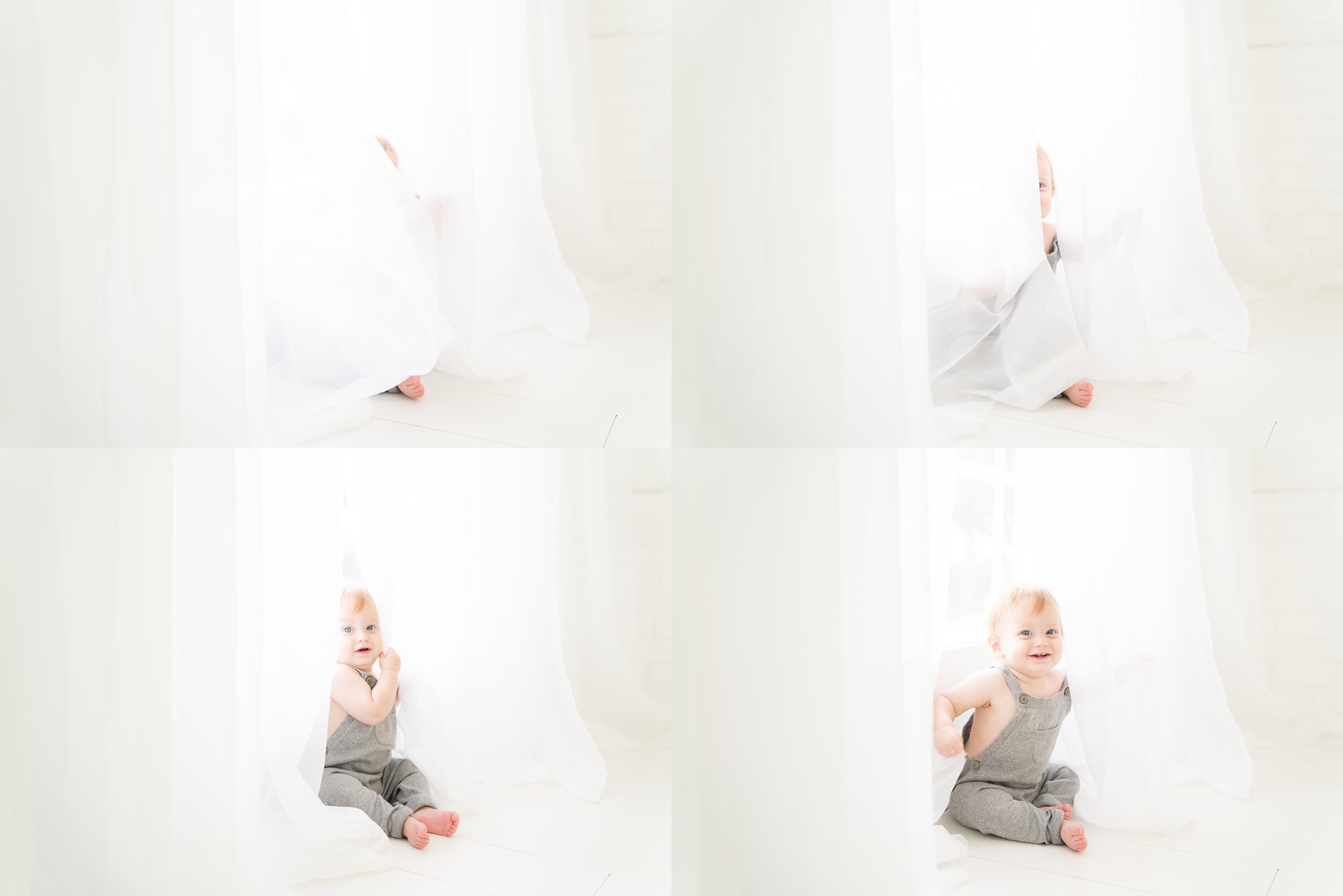 Baby being photographed playing pee-ab-boo in the curtains.