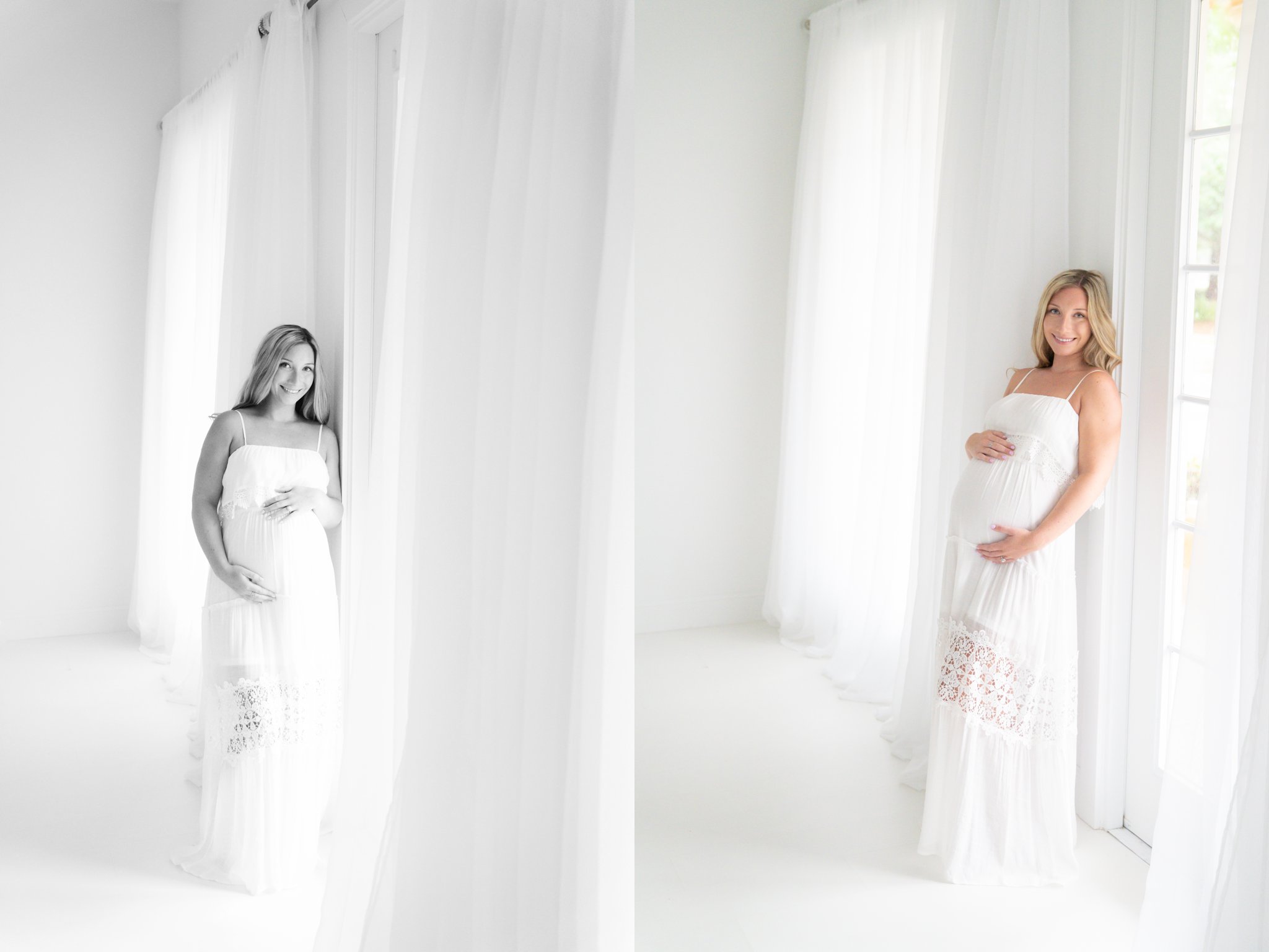 Pregnant woman standing by large window being photographed during maternity session