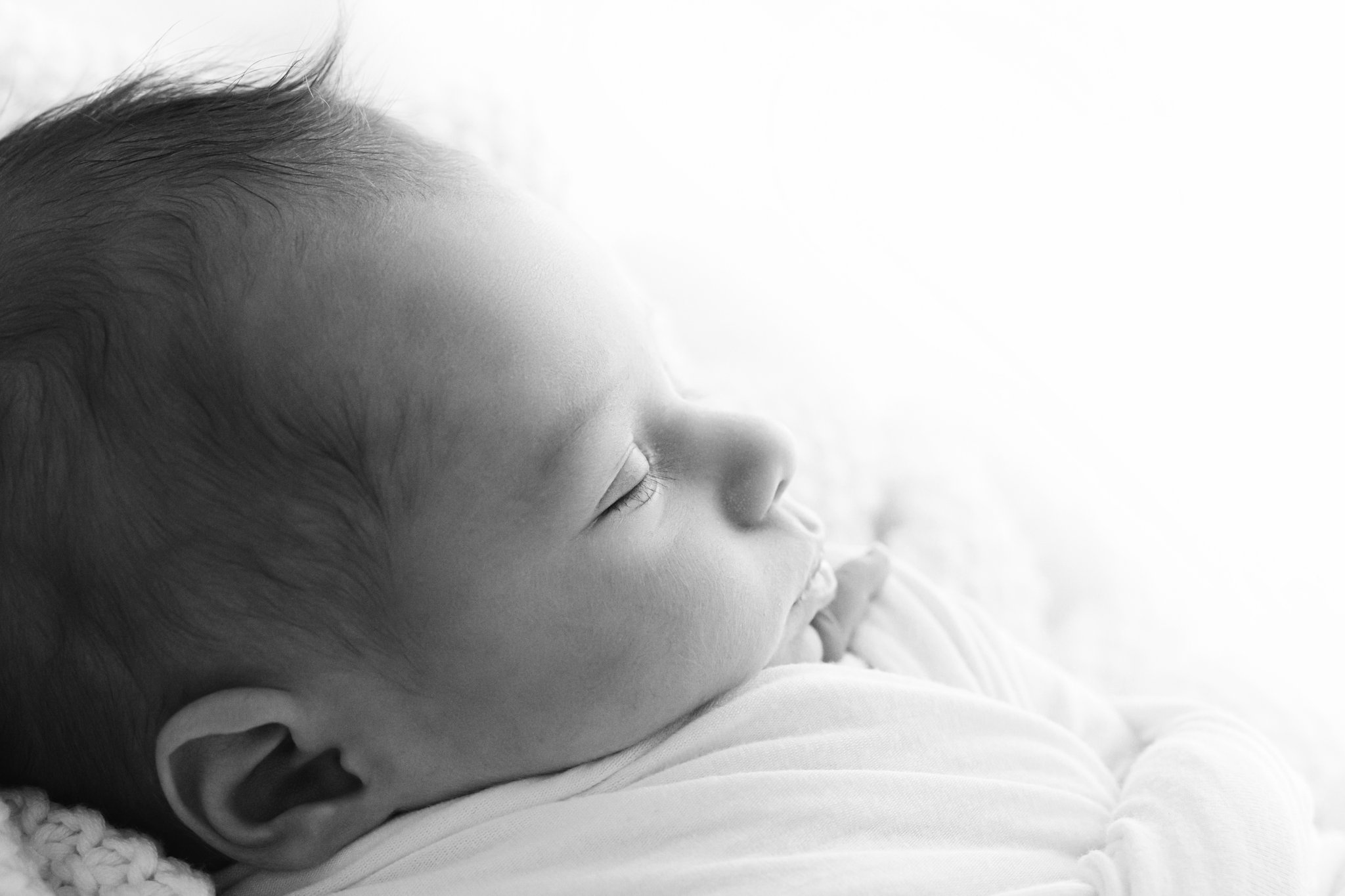 black and white profile of a newborn baby
