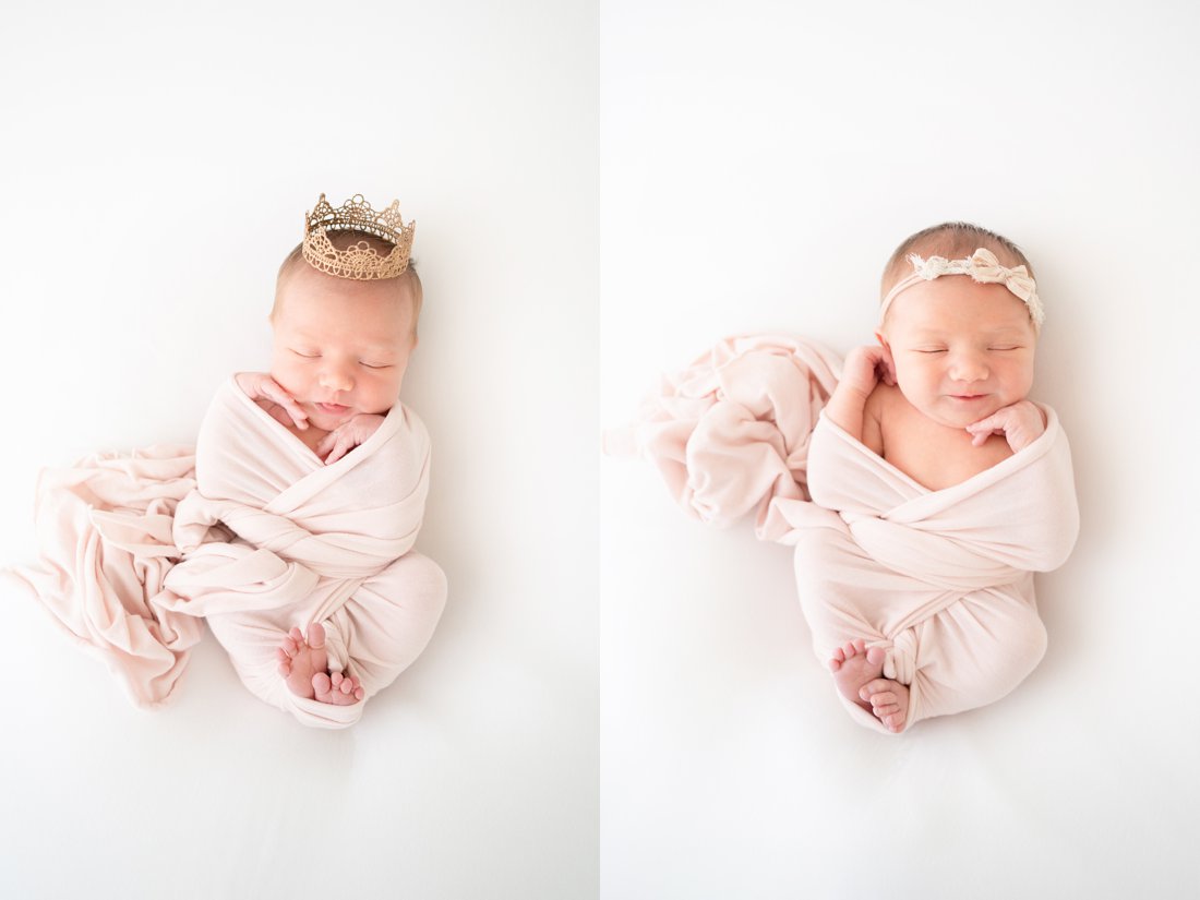 Newborn baby swaddled in a pink wrap lying on her back wearing a princess crown