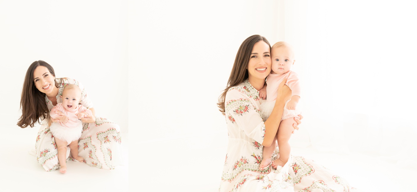 Mom and baby being photographed in a white photography studio